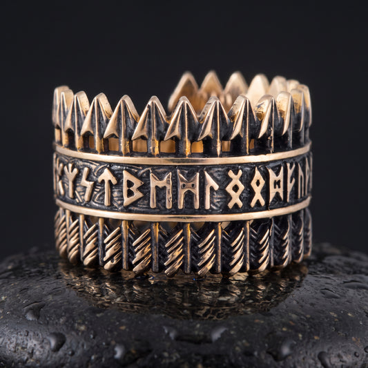 Handmade bronze Viking ring seen front on, openwork arrows above and below a runic band