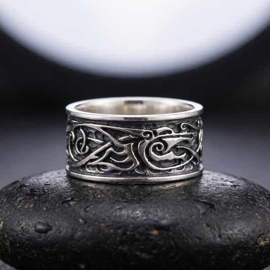 Handmade 925 silver Viking ring seen front on, fine Norse interlace between polished rails