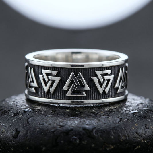 Handmade 925 silver Viking ring seen front on, Valknuts on an oxidised hatched ground