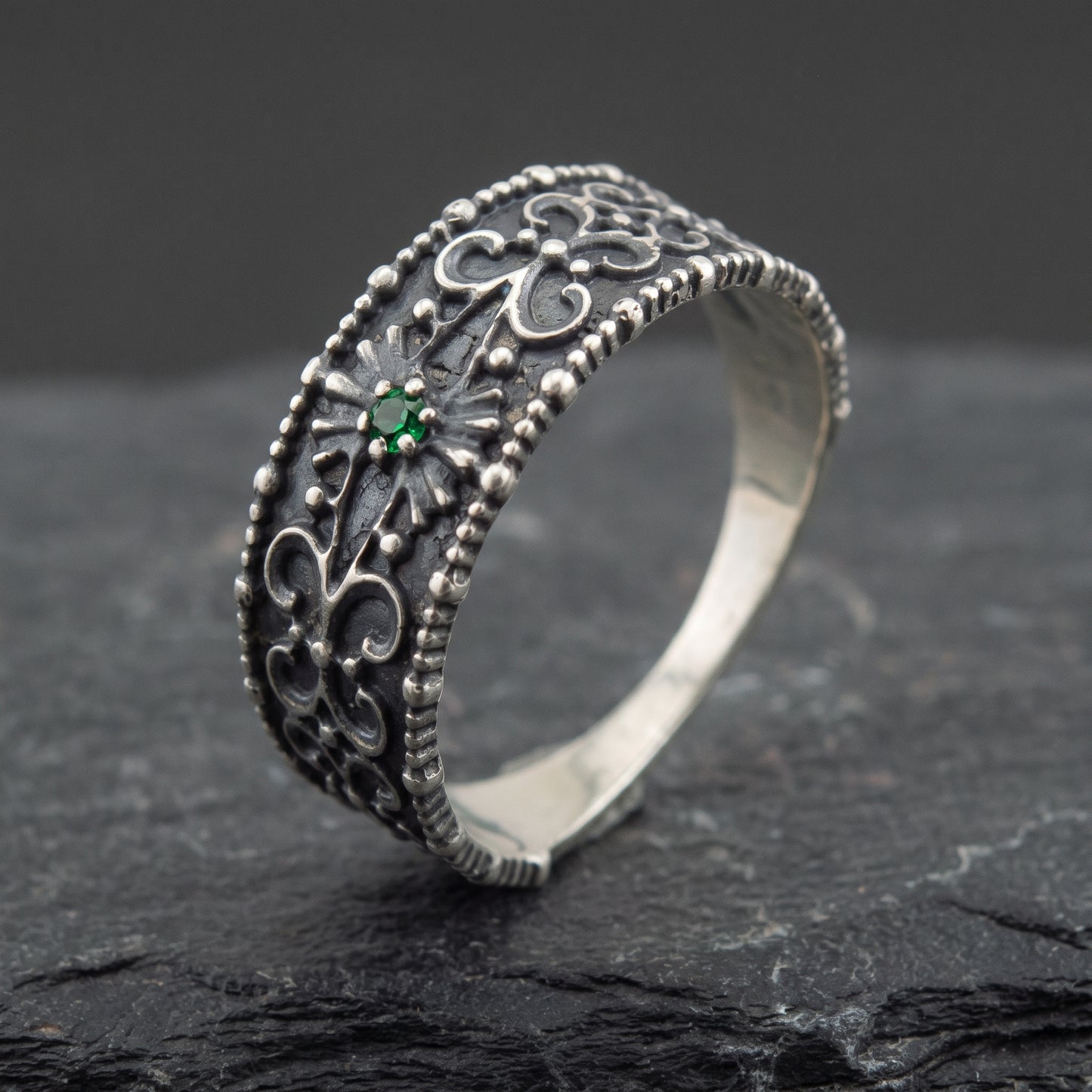 Silver ornament ring from the side, polished interior visible