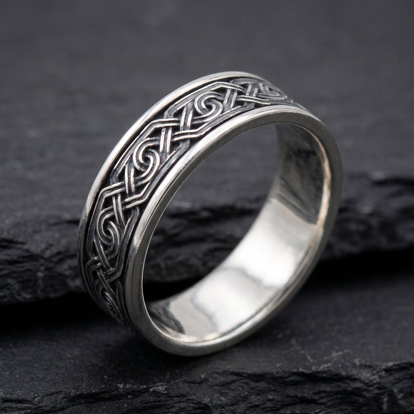 Silver Viking knot ring from the side, polished interior visible