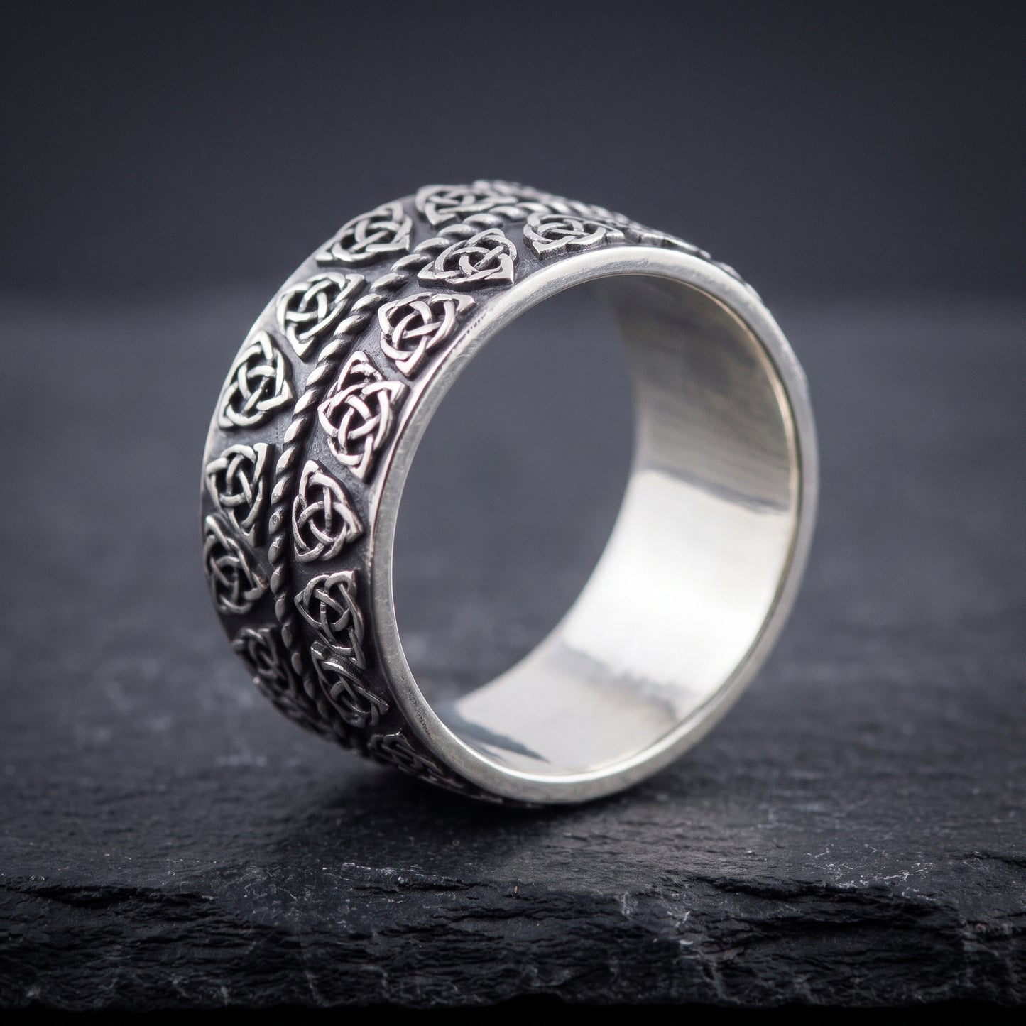 Silver triquetra Viking ring from the side, polished interior visible
