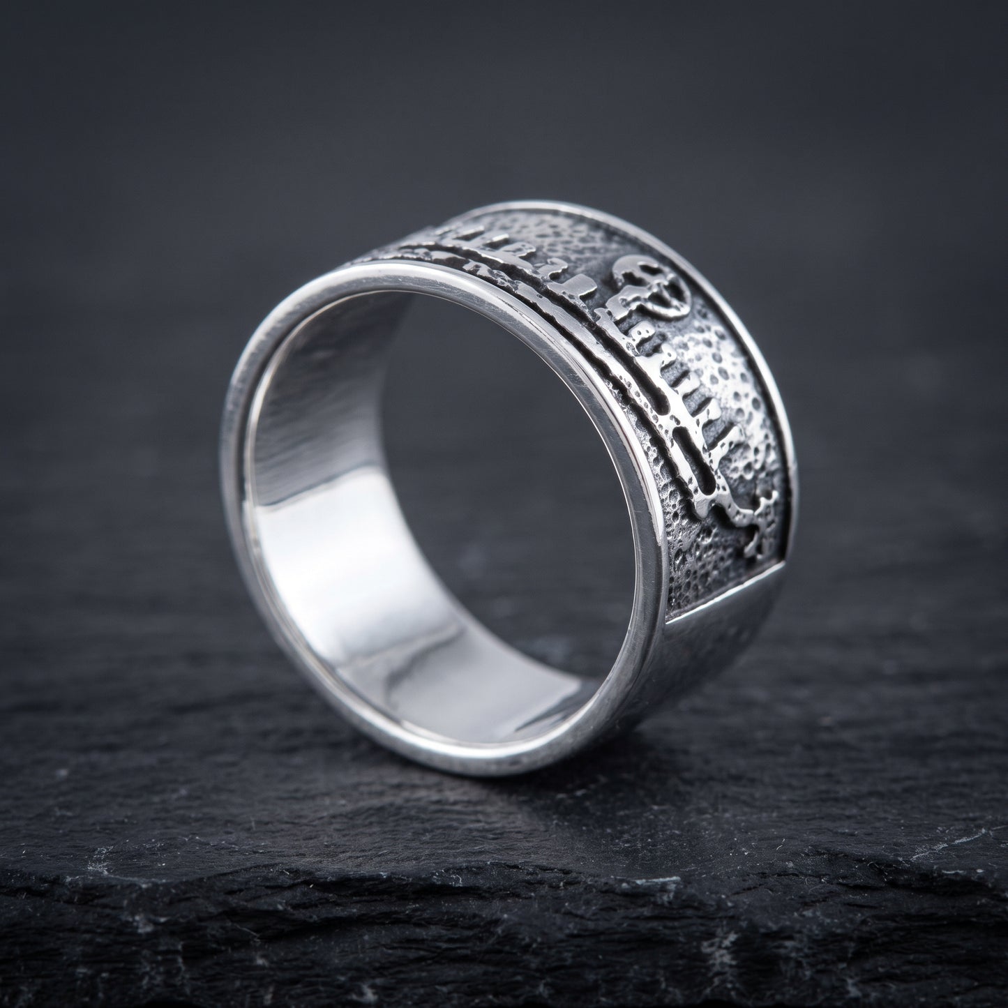 Silver drakkar Viking ring from the side, flat band of even width and polished interior
