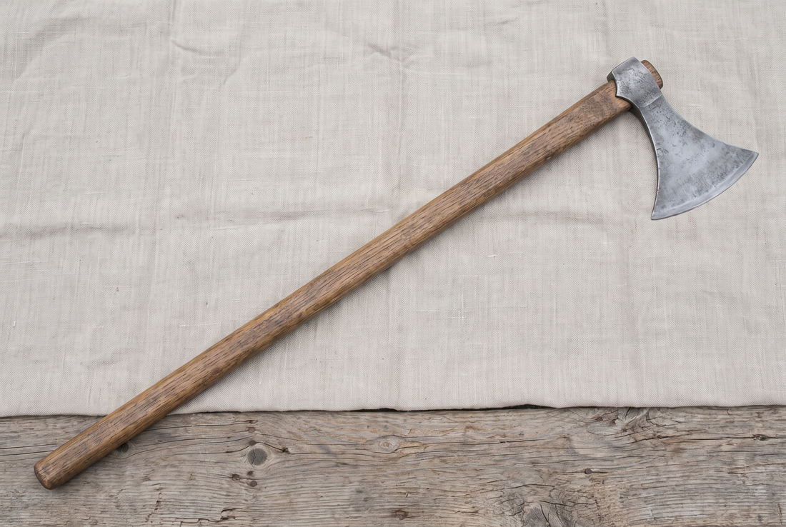 A complete hand-forged two-handed Viking Dane axe (breiðøx): a broad single-edged crescent head on a long wooden haft