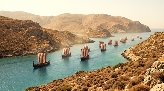 Viking fleet sailing through a narrow sun-baked Mediterranean strait