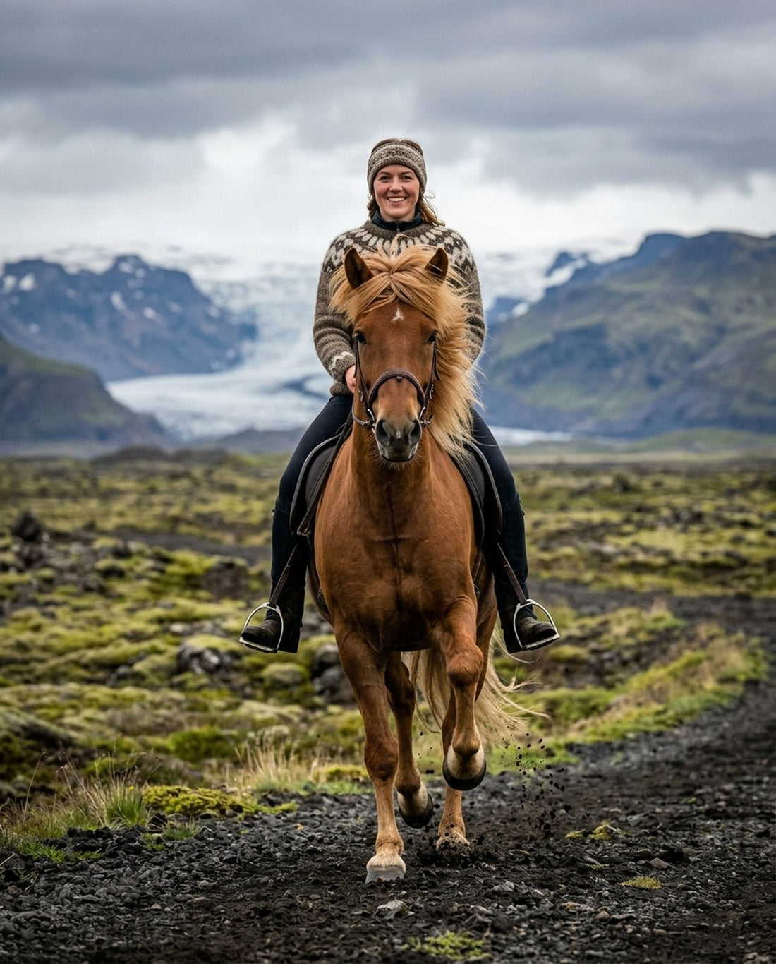 A rider on an Icelandic horse on a moss-covered track below a glacier