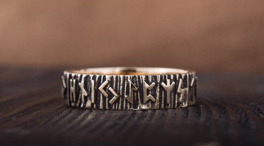 Viking wedding ring on a wooden background