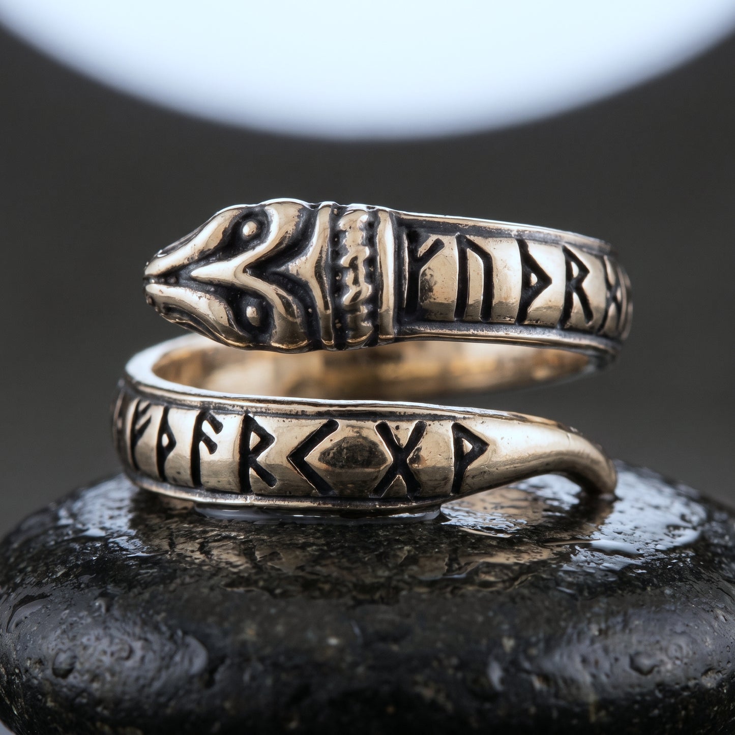 Handmade bronze serpent ring coiled in an open spiral with Elder Futhark runes