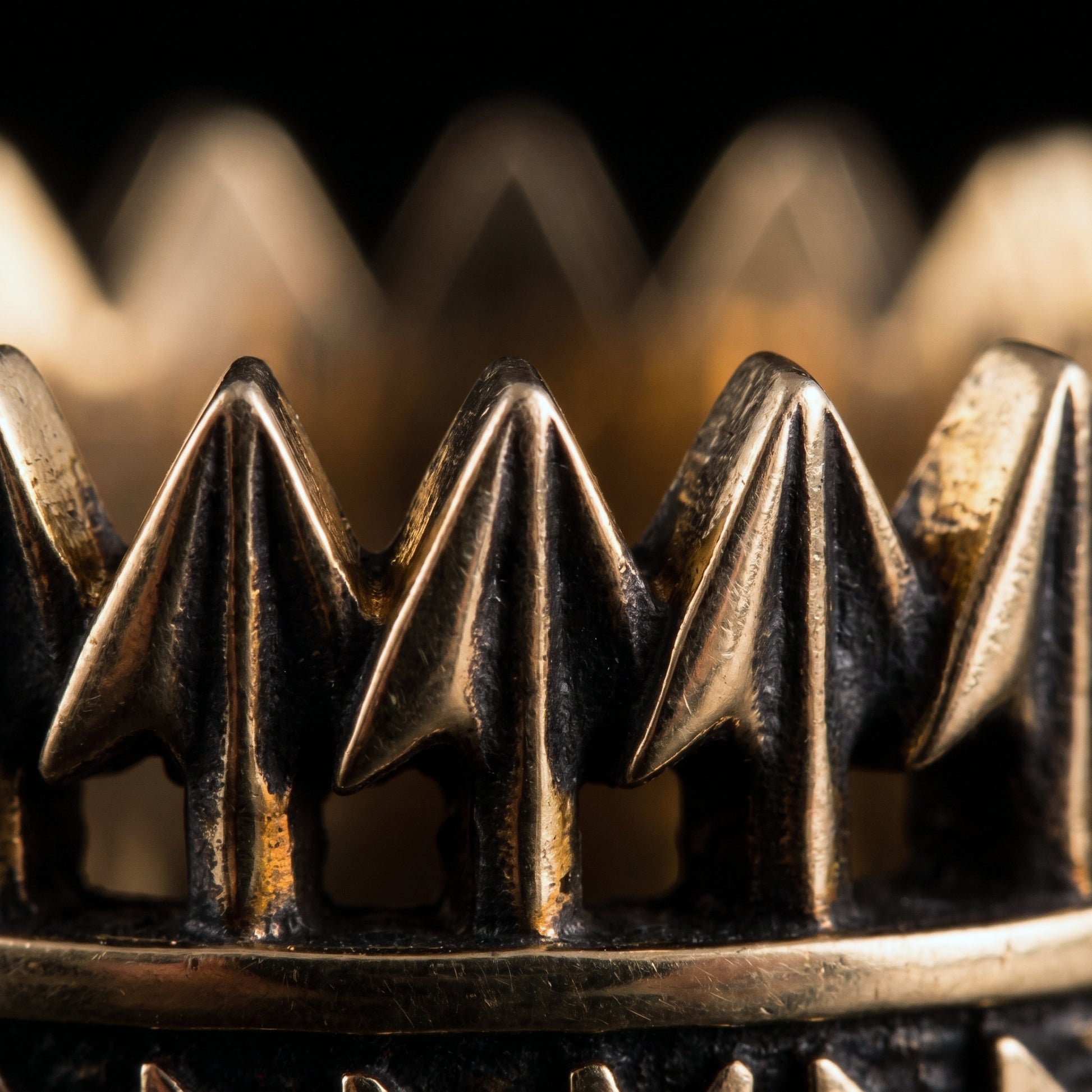 Macro of the openwork bronze arrowheads on the Viking ring