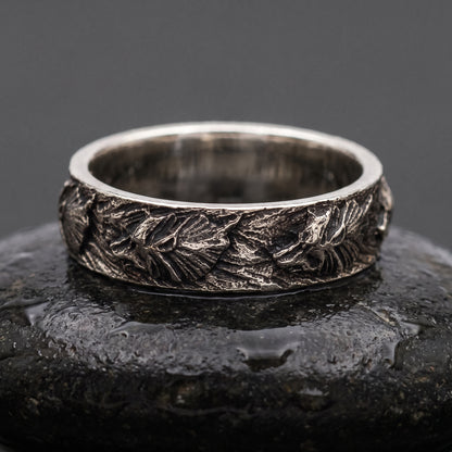 Hand-carved 925 silver Fenrir wolf band seen front on, wolf heads and manes in oxidised relief