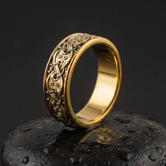 Handmade gold Viking ring seen front on, knotwork band between polished gold rails