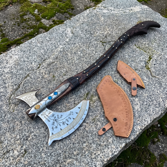 Kratos Leviathan axe with gold-tone knotwork edge and black rune etching, shown with its two leather blade covers