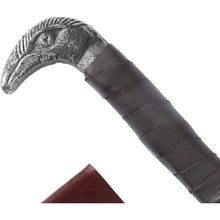 Close-up of the cast raven's-head pommel and leather-wrapped grip on the Raven's Beak Viking seax knife