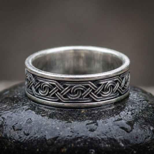 Handmade 925 silver Viking ring seen front on, interlaced knot chain between polished rails