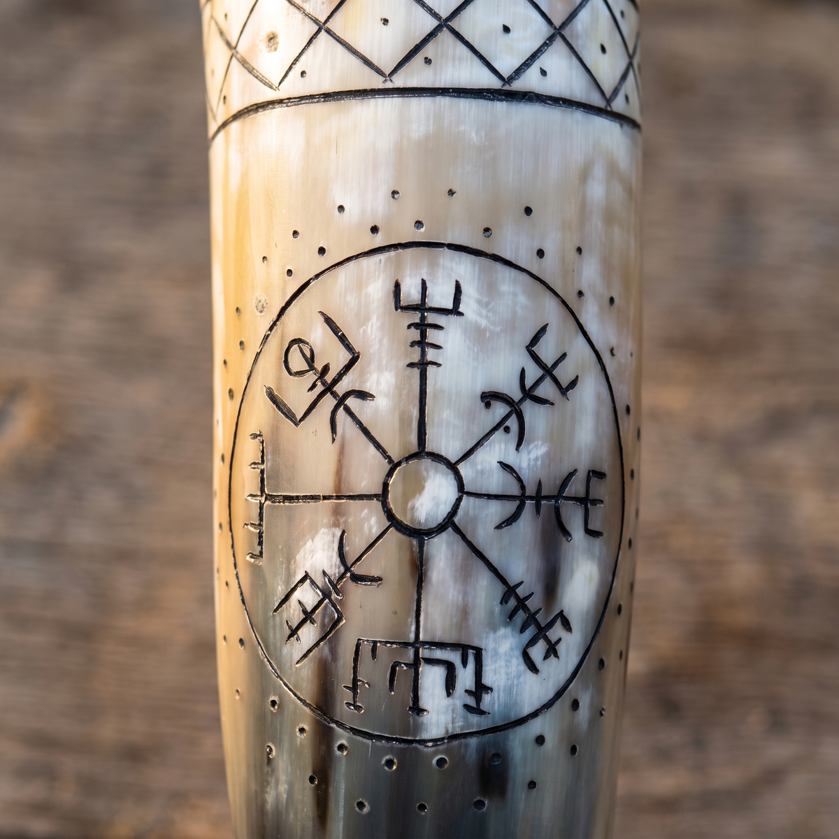 Close-up of the hand-engraved Vegvisir circle and lattice band on the drinking horn