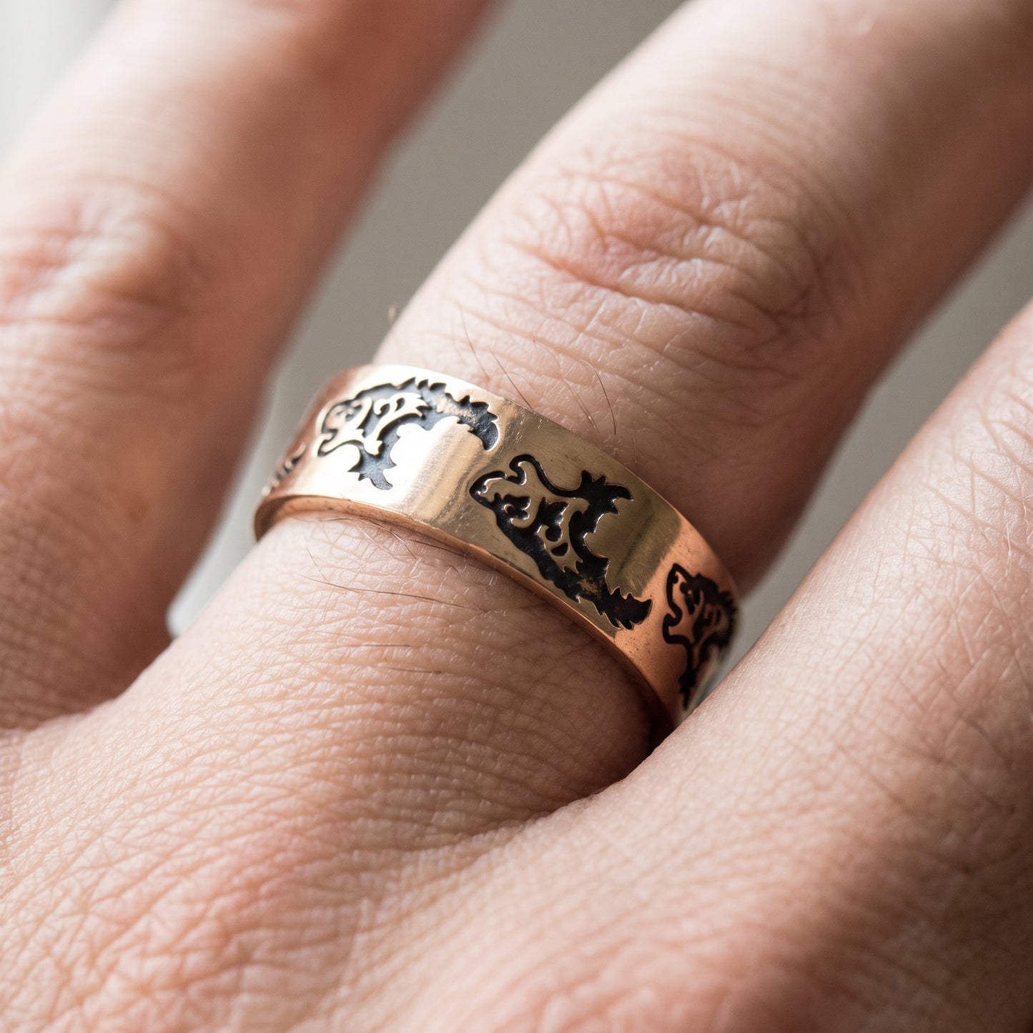 Bronze Viking wolf ring worn on a finger