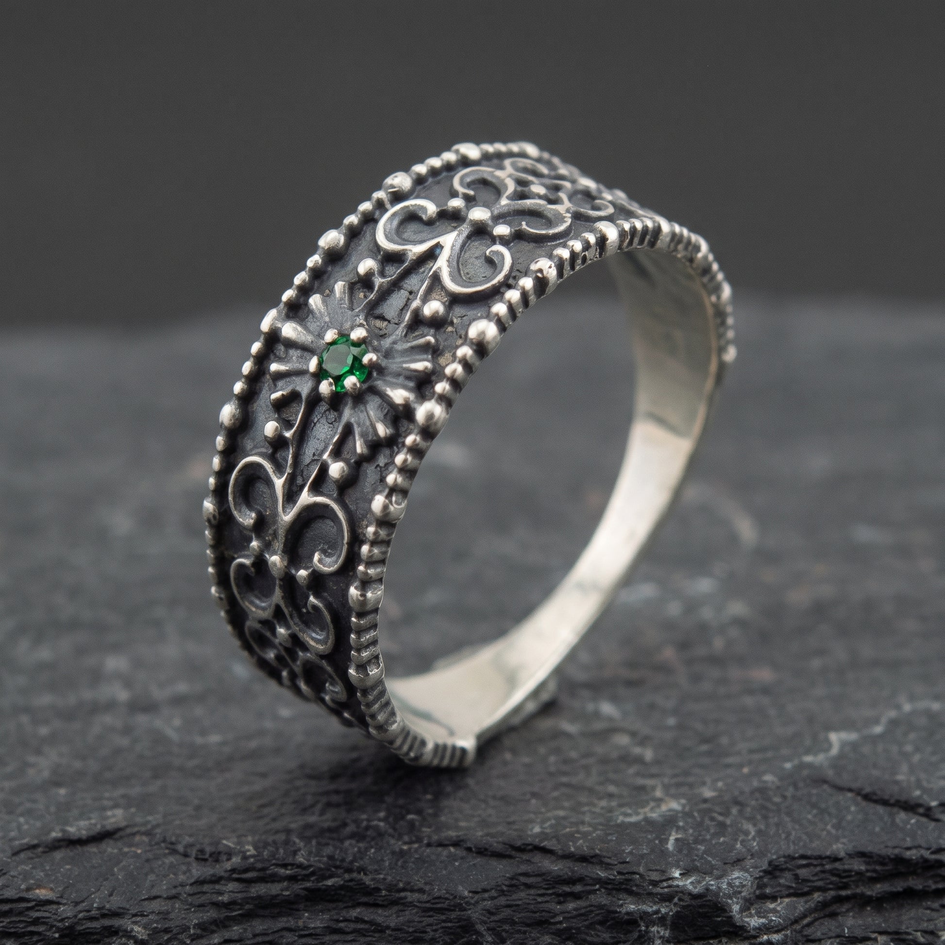 Silver ornament ring from the side, polished interior visible
