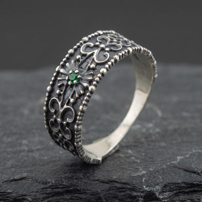 Silver ornament ring from the side, polished interior visible