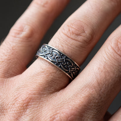 Blackened silver interlace Viking ring worn on a finger