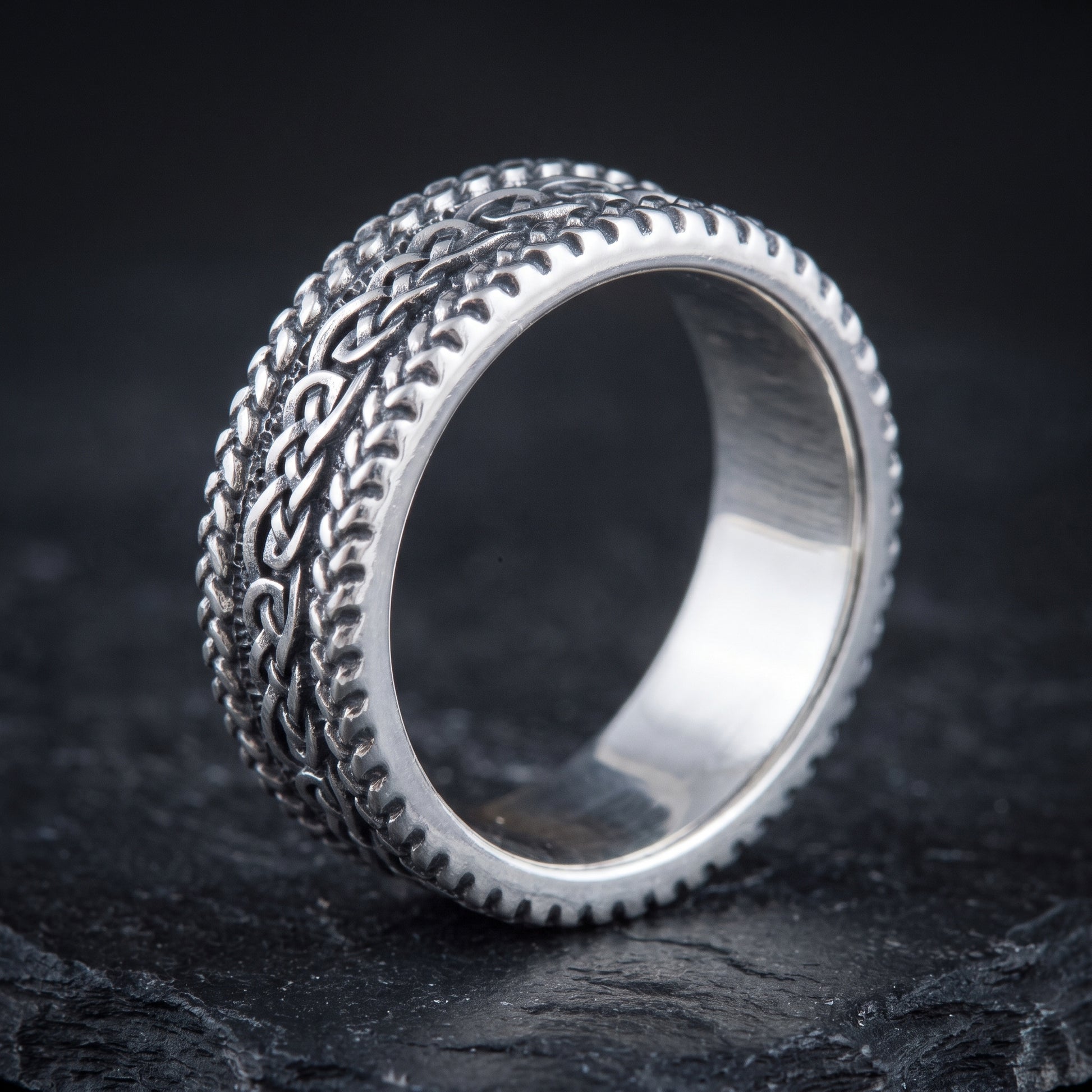 Braided silver Viking ring from the side, polished interior visible