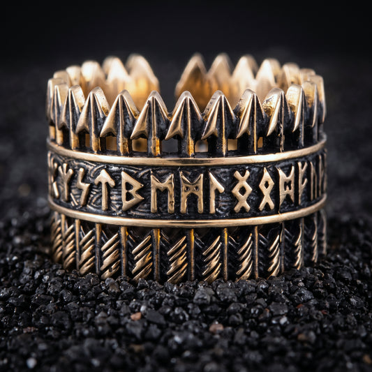 Bronze Viking ring with rows of arrows and Elder Futhark runes on black volcanic sand