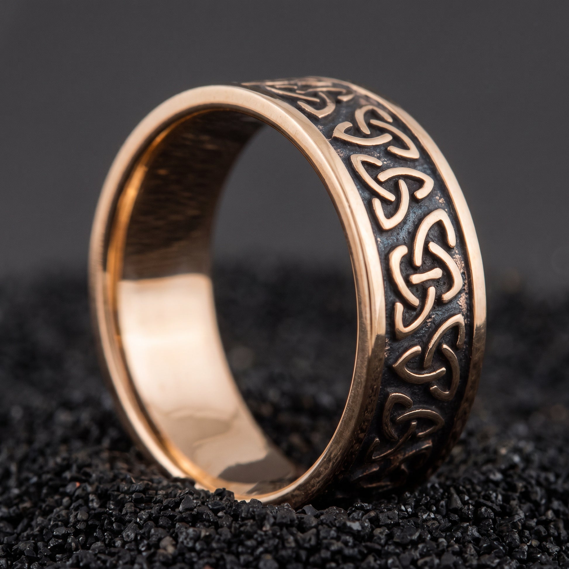 Bronze triquetra Viking ring from the side, polished interior visible