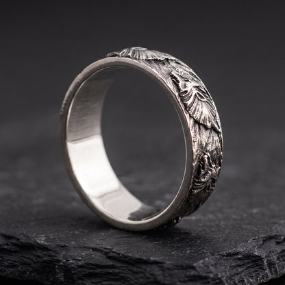 Hand-carved silver Fenrir wolf ring from the side, smooth polished interior