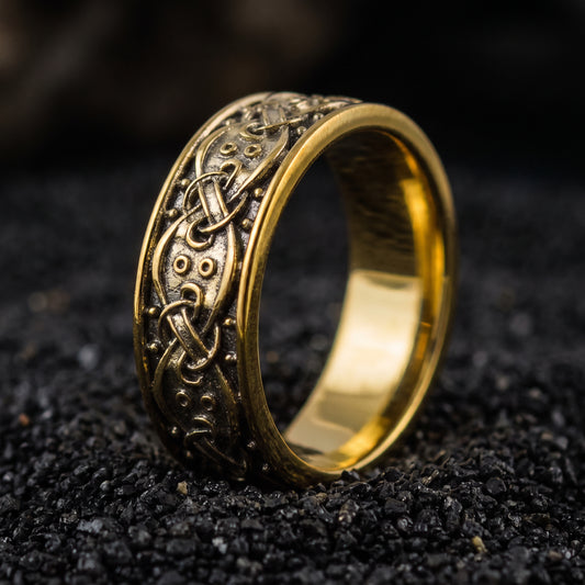 Solid gold Viking wedding ring with Norse knotwork and raised bosses