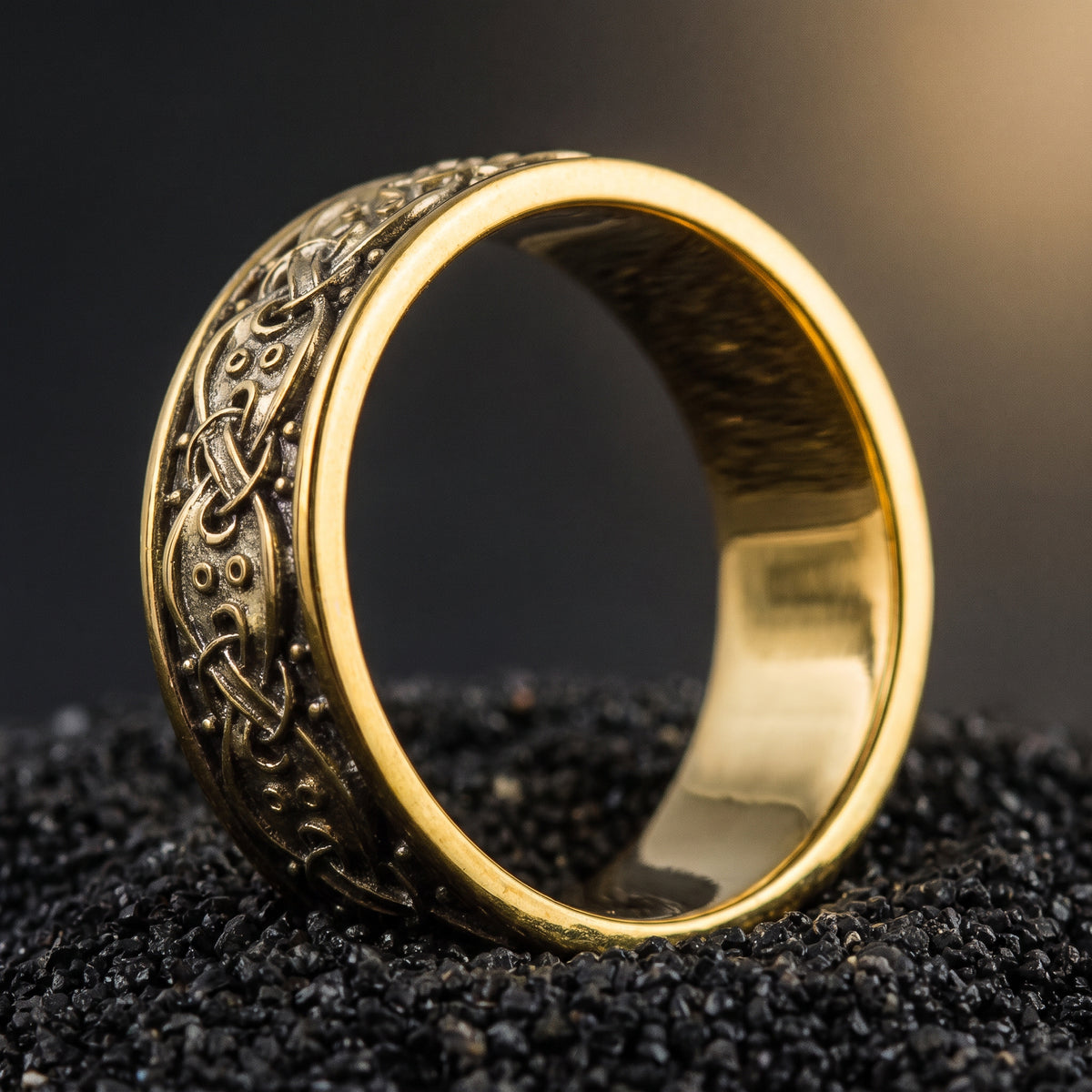Gold Viking knotwork ring from the side, mirror polished interior