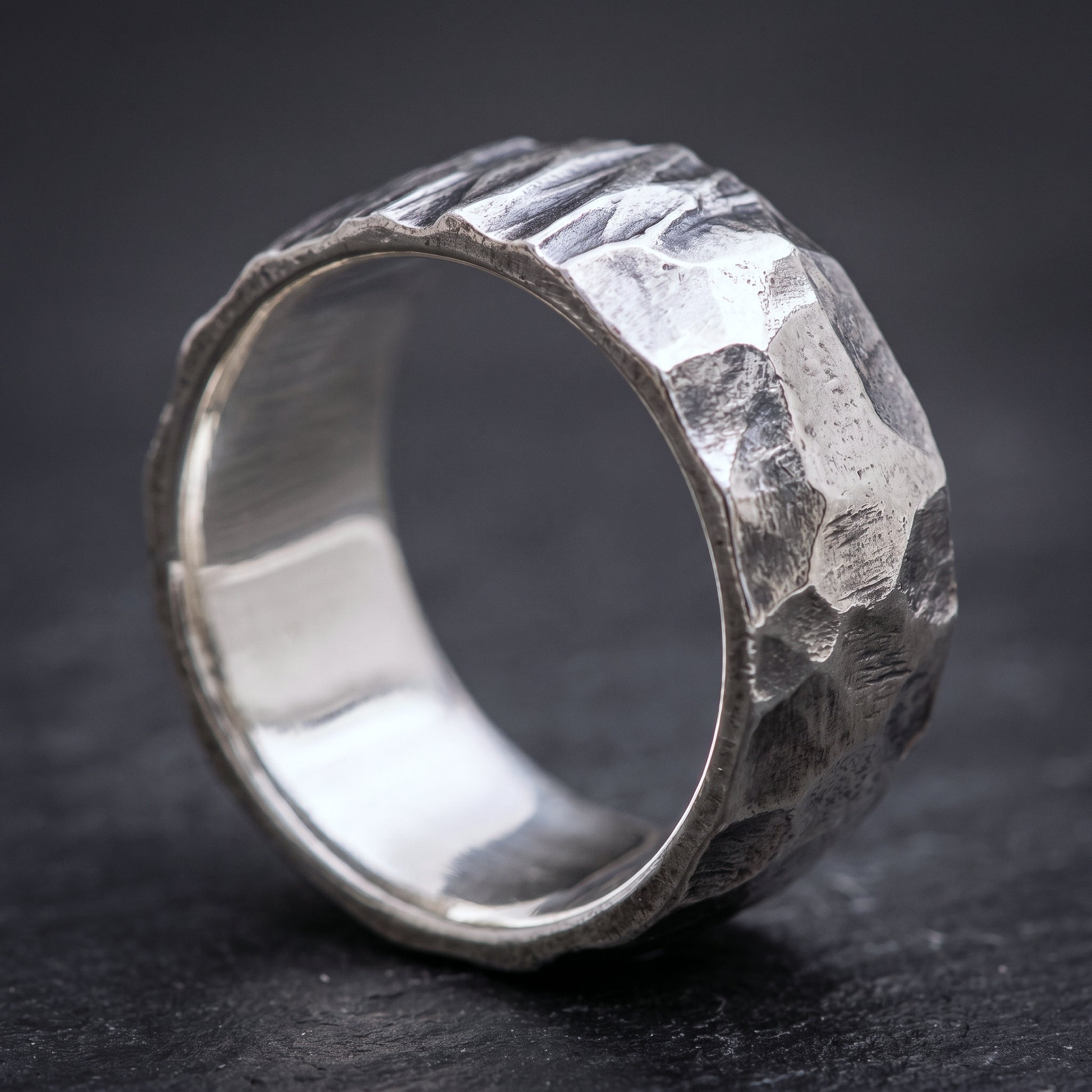 Hammered silver Viking band from the side, smooth polished interior