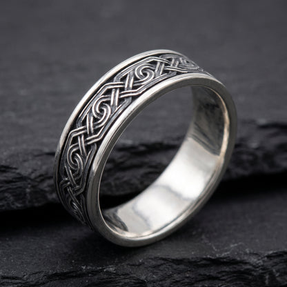 Silver Viking knot ring from the side, polished interior visible