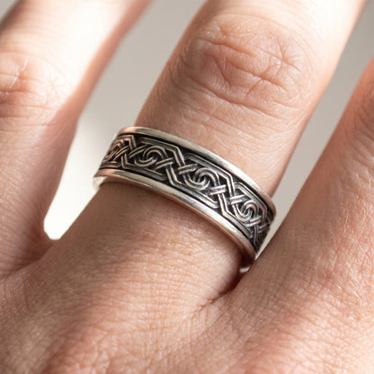 Silver Viking knot ring worn on a finger