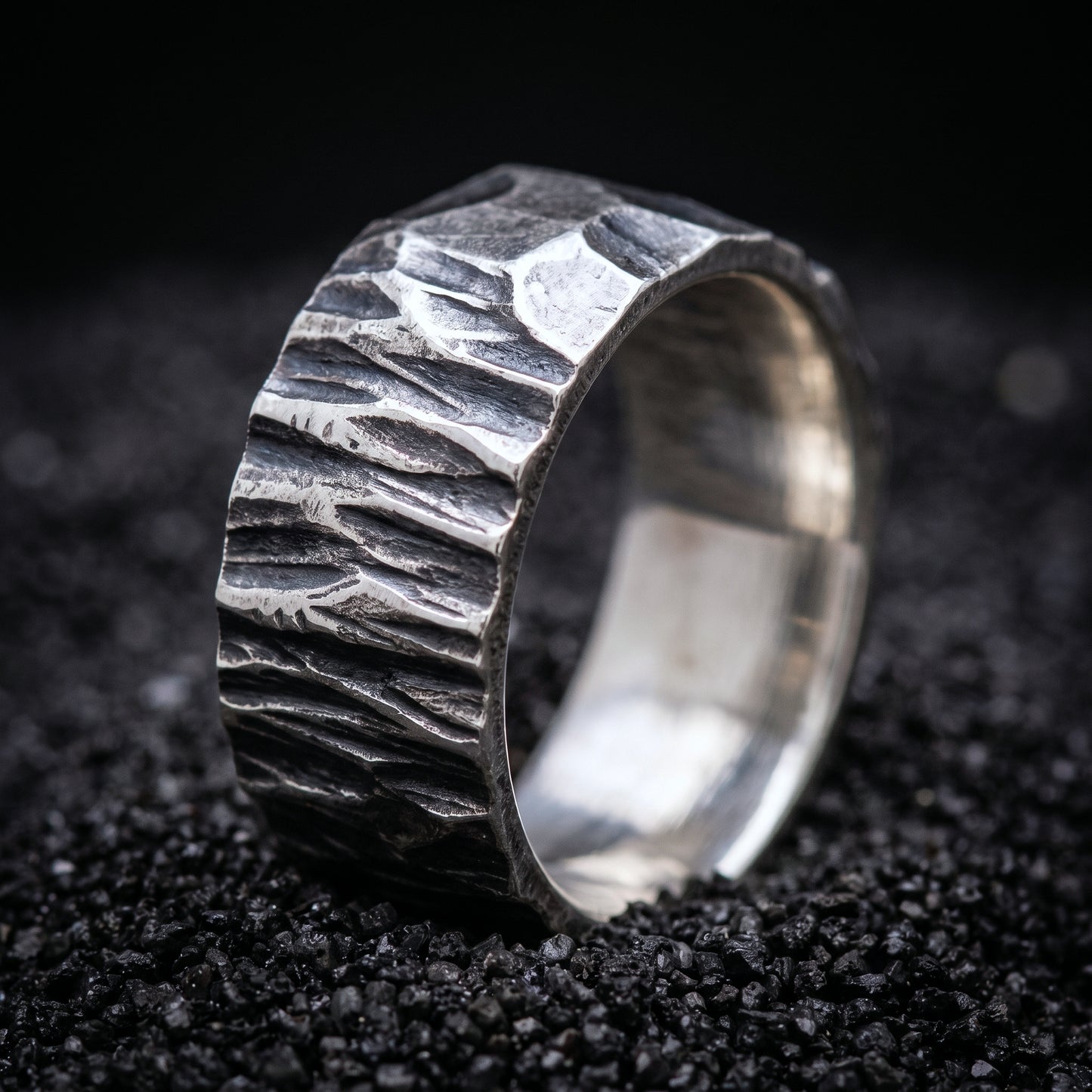 Hand-forged sterling silver Viking wedding band with a rough hammered surface