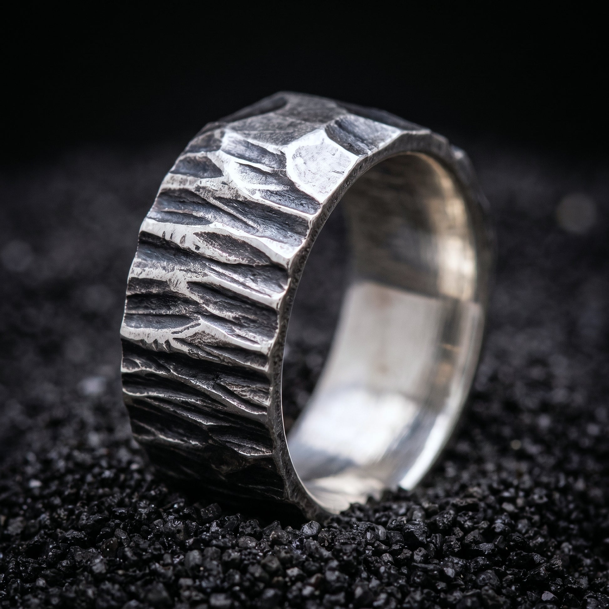 Hand-forged sterling silver Viking wedding band with a rough hammered surface
