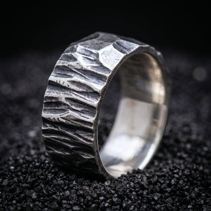 Hand-forged sterling silver Viking wedding band with a rough hammered surface