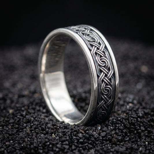 Sterling silver Viking wedding ring with a chain of Norse knots in an oxidised channel