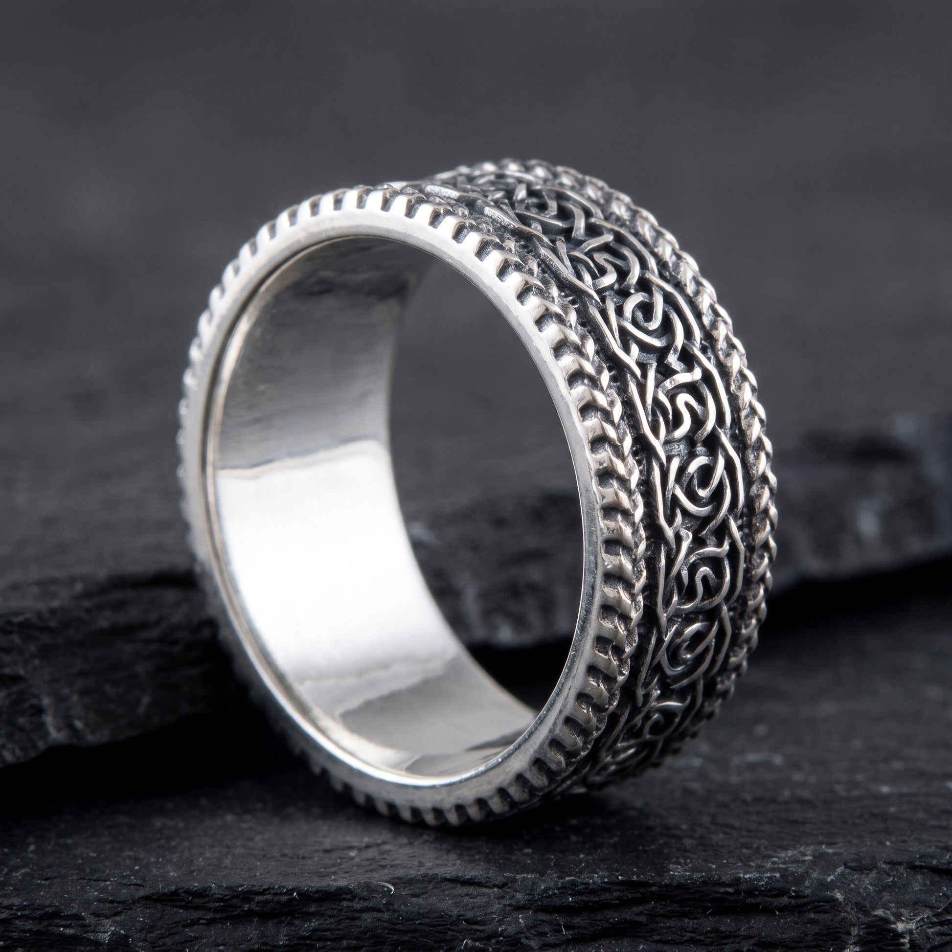Silver Viking knotwork ring from the side, polished interior visible
