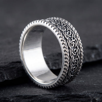 Silver Viking knotwork ring from the side, polished interior visible