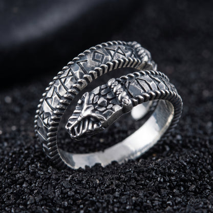Sterling silver Ouroboros Viking ring with Elder Futhark runes on black volcanic sand