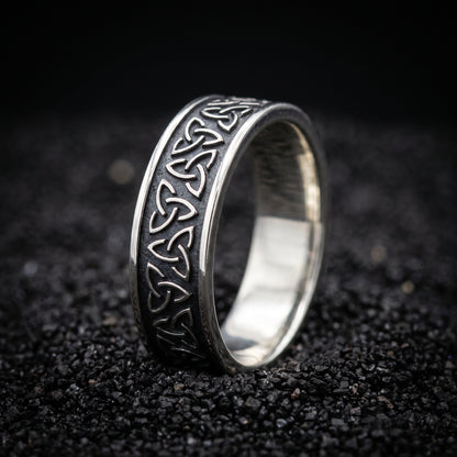 Narrow sterling silver Viking ring with a row of triquetra knots
