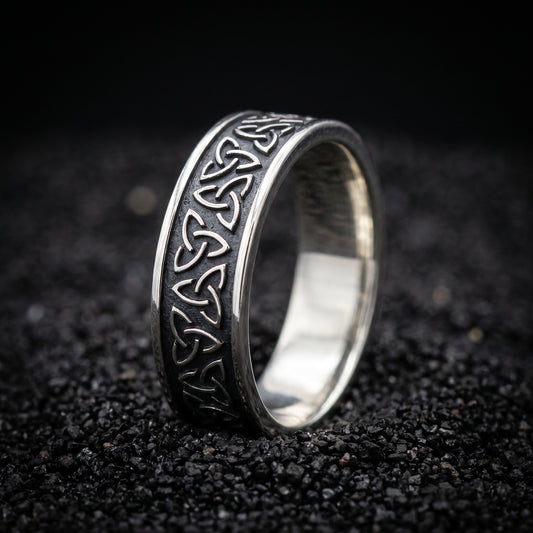 Narrow sterling silver Viking ring with a row of triquetra knots