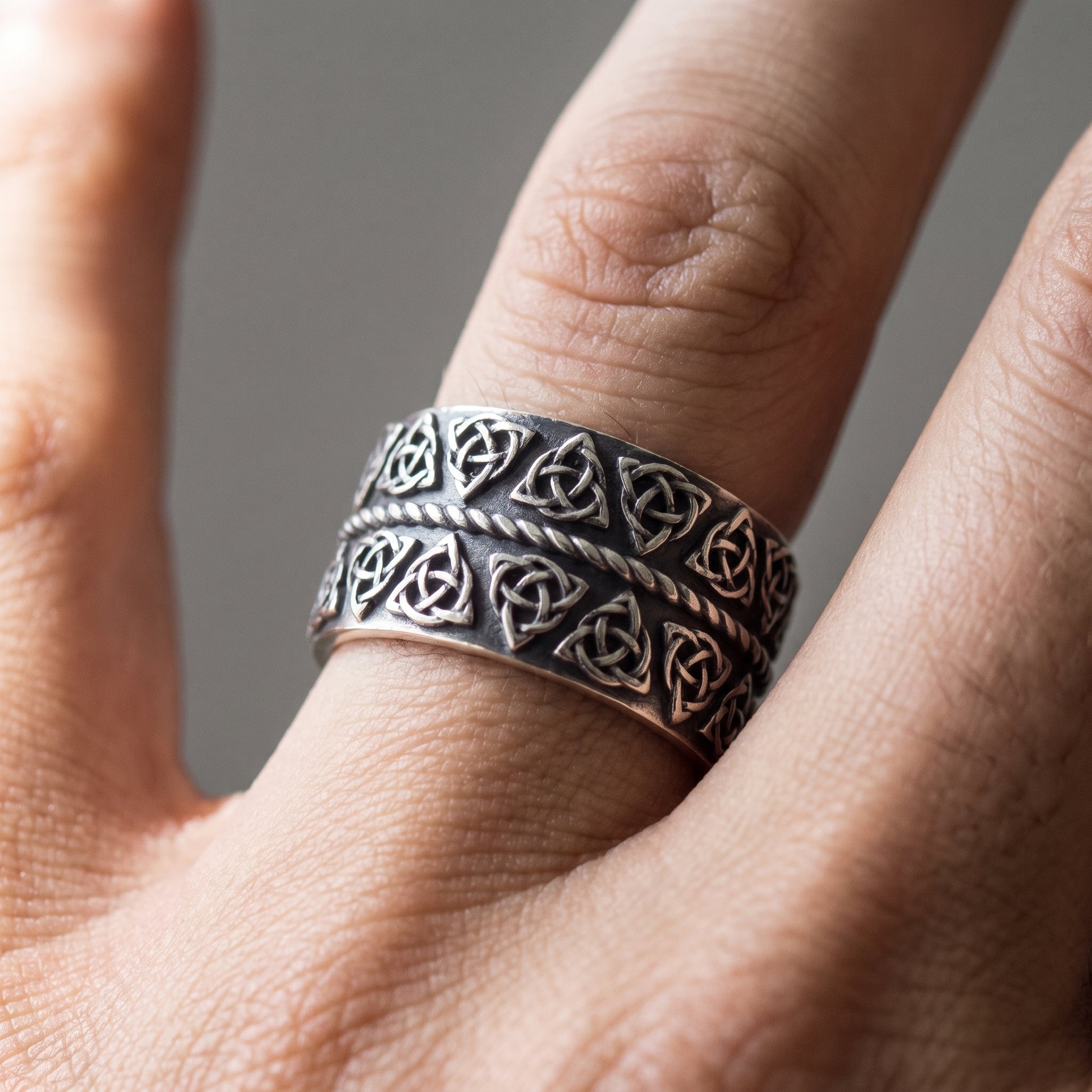 Silver triquetra Viking ring worn on a finger