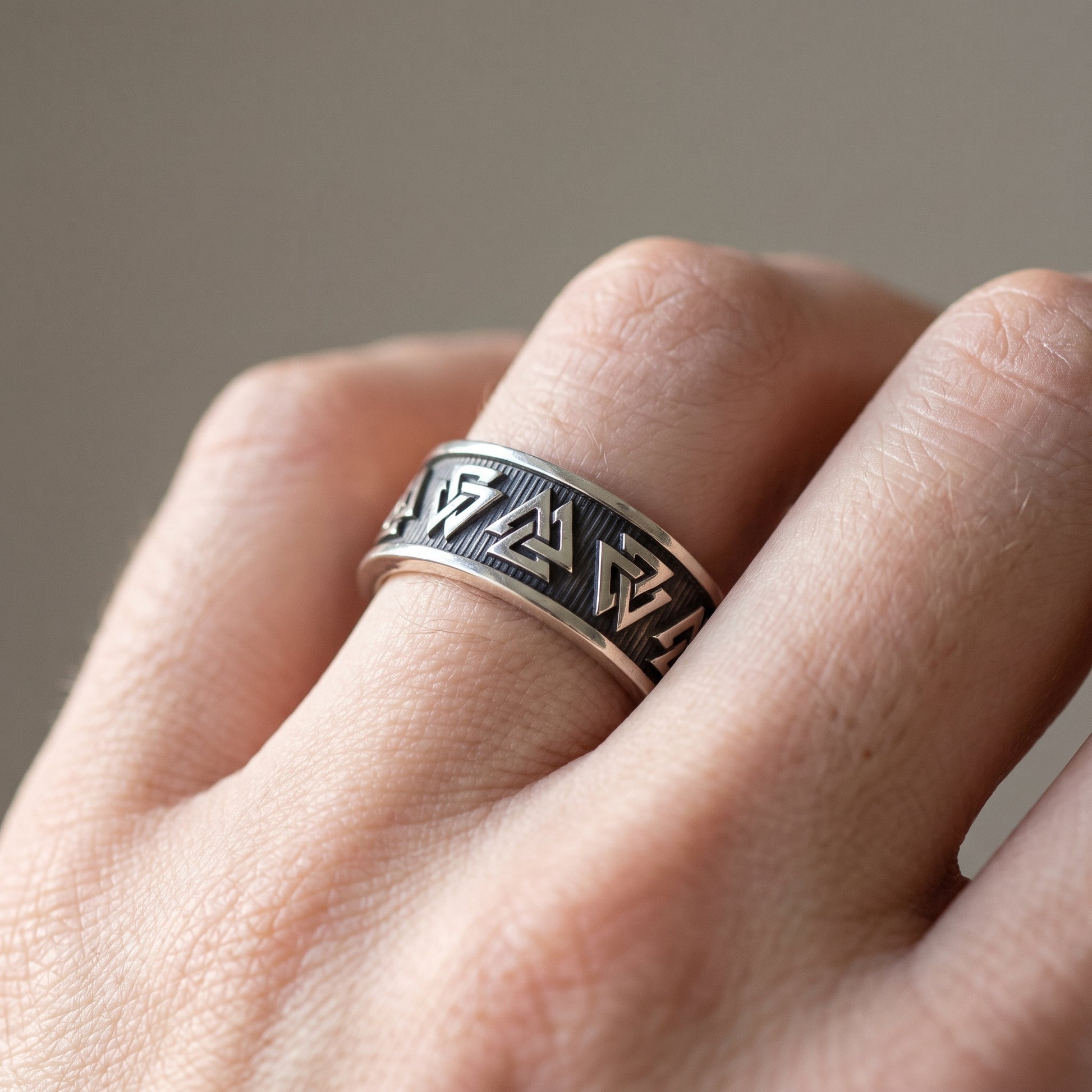 Silver Valknut Viking wedding ring worn on a finger