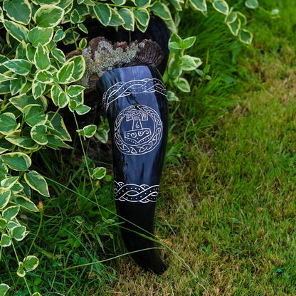 Thor's hammer drinking horn resting among ivy and grass