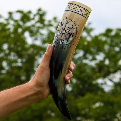 Hand holding the 18 inch Vegvisir drinking horn outdoors