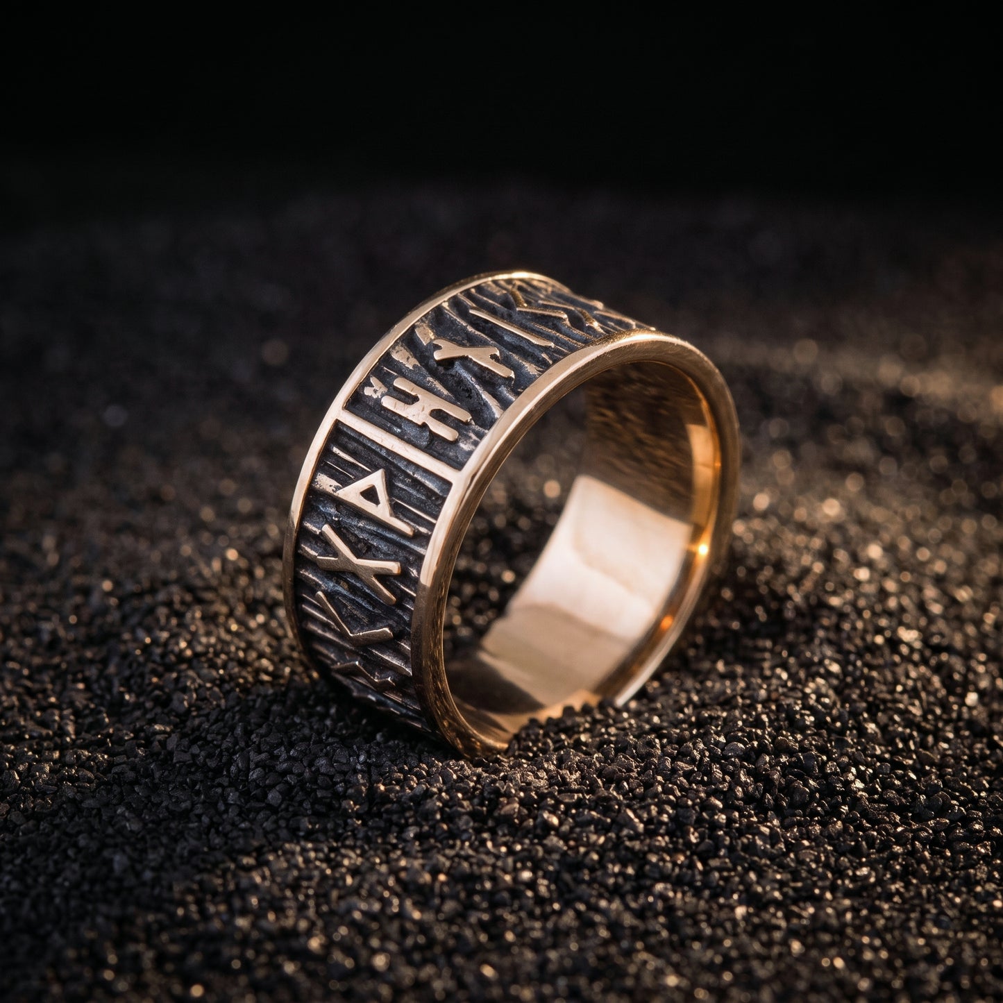 Bronze rune ring from the side showing the wide rim and plain polished interior