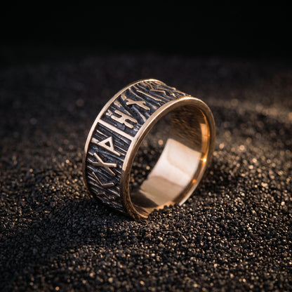 Bronze rune ring from the side showing the wide rim and plain polished interior
