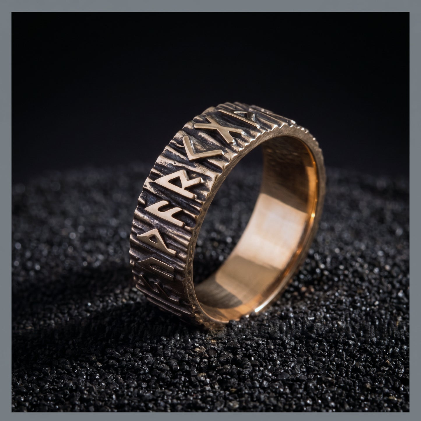 Bronze rune wedding ring from the side, toothed rims and polished interior