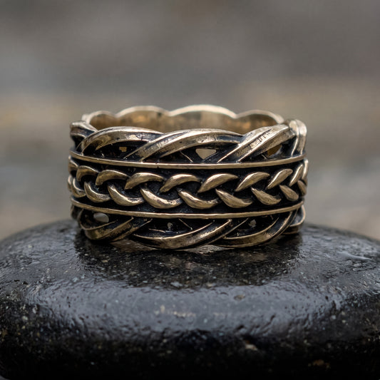 Handmade bronze Viking ring seen front on, three rows of Scandinavian woven ornament