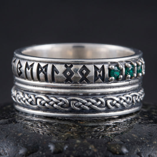 Handmade 925 silver rune ring seen front on, runes, green stones and plaited knotwork band